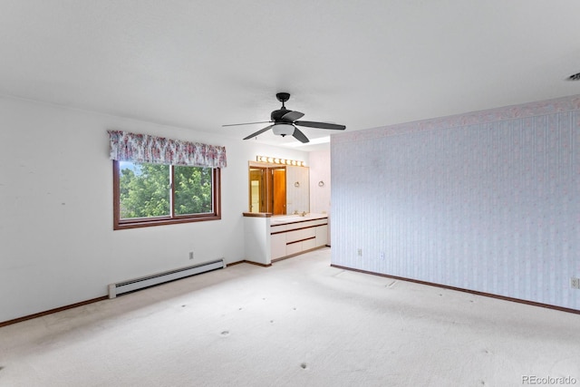 11686 W 74th Way, Arvada, CO 80005 - spare room featuring a baseboard radiator, light carpet, and a ceiling fan