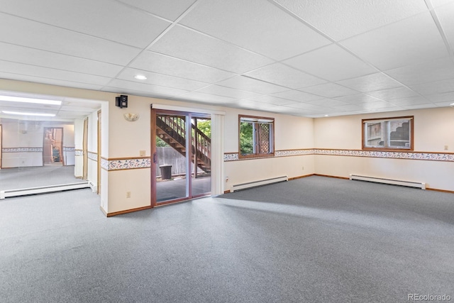 11686 W 74th Way, Arvada, CO 80005 - empty room with baseboard heating, a baseboard radiator, a drop ceiling, stairs, and recessed lighting