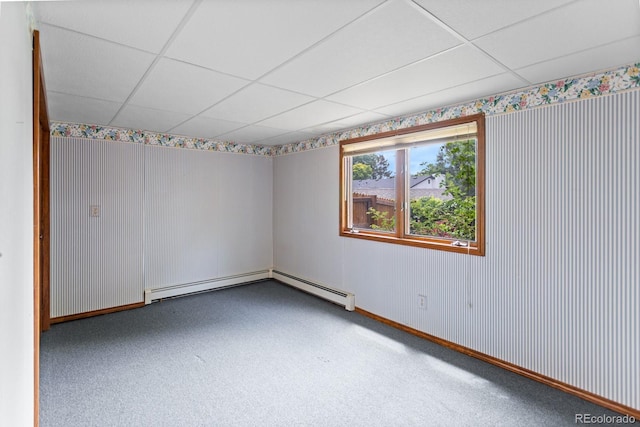 11686 W 74th Way, Arvada, CO 80005 - spare room with a drop ceiling, carpet floors, and a baseboard heating unit