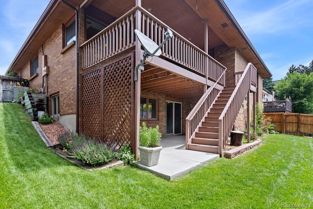 11686 W 74th Way, Arvada, CO 80005 - rear view of property with brick siding, a deck, a patio area, and stairway