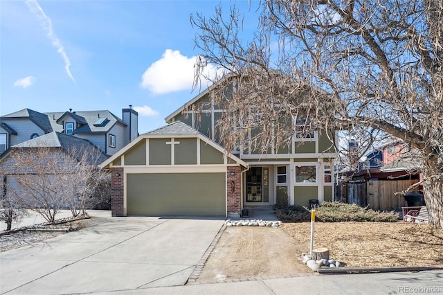 view of front of home featuring an attached garage, stucco siding, driveway, and brick siding