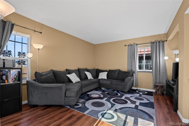 living room featuring dark wood finished floors and baseboards