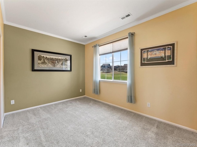 unfurnished room with carpet flooring, crown molding, visible vents, and baseboards