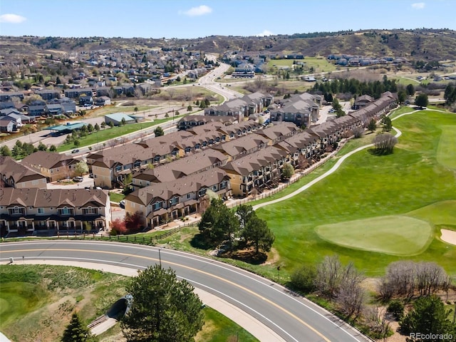 bird's eye view with view of golf course and a residential view