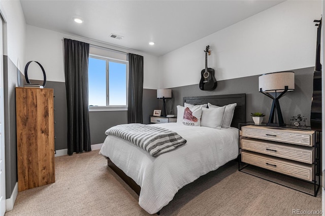 bedroom featuring light carpet