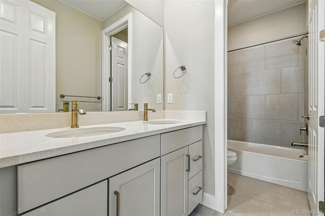 full bathroom with toilet, tile patterned flooring, a sink, and double vanity