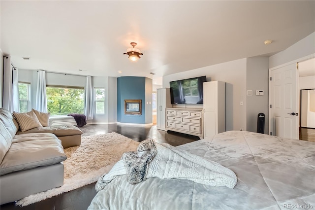 bedroom with baseboards and wood finished floors