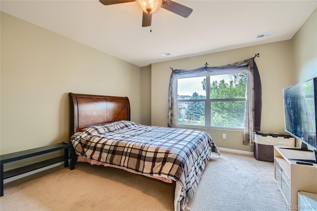 bedroom featuring baseboards, carpet, a ceiling fan, and visible vents