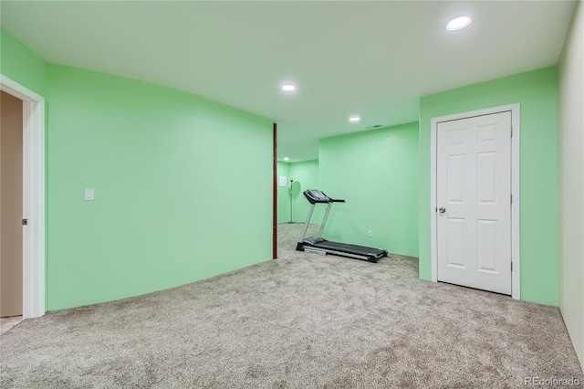exercise area with recessed lighting and carpet