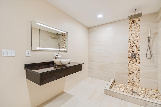 full bathroom featuring recessed lighting, a sink, and a walk in shower