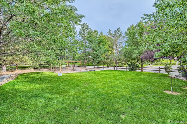view of yard with a gazebo and fence