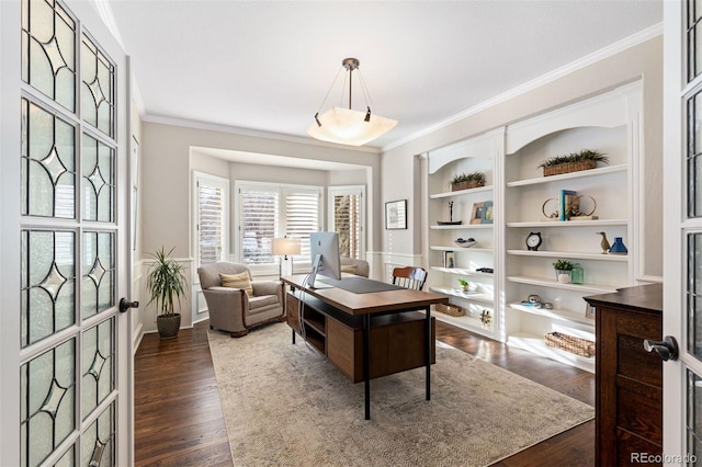 office space featuring french doors, ornamental molding, dark wood-type flooring, and built in shelves