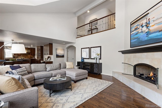 living room featuring hardwood / wood-style floors and a high end fireplace