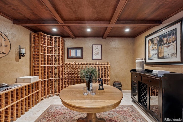 wine area featuring coffered ceiling, wood ceiling, and beam ceiling