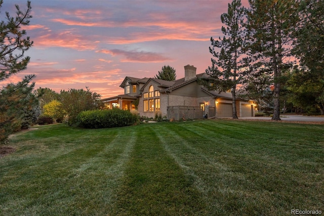 property exterior at dusk featuring a yard