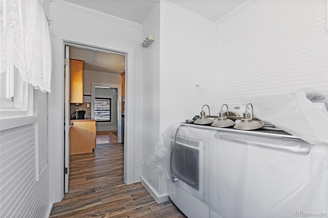 laundry room with crown molding, a fireplace, and dark wood-type flooring