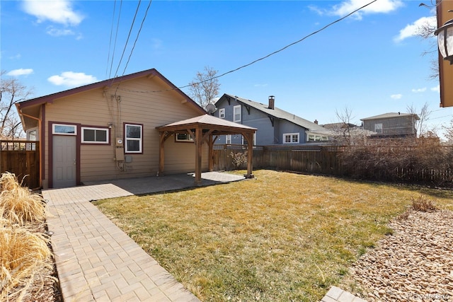 back of house featuring a gazebo, a yard, a patio, and fence private yard