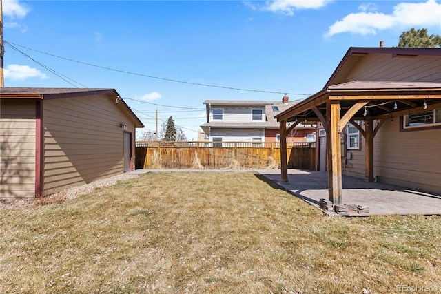 view of yard featuring fence and a patio area