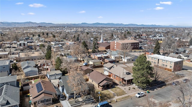 drone / aerial view featuring a residential view and a mountain view