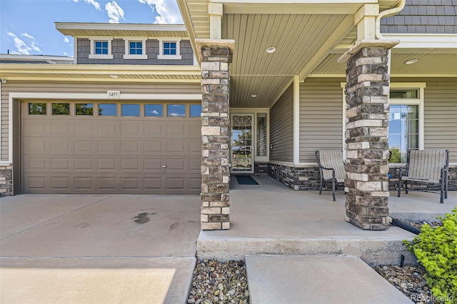 5495 Espana Ct, Denver, CO 80249 - garage with a porch and driveway