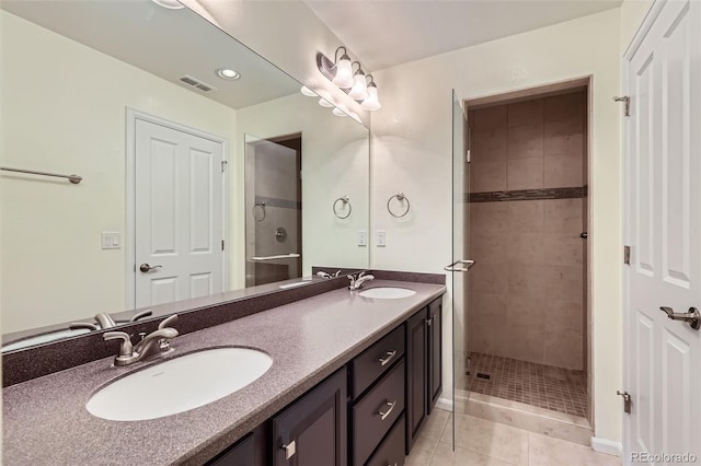 5495 Espana Ct, Denver, CO 80249 - full bath with double vanity, tiled shower, and tile patterned floors
