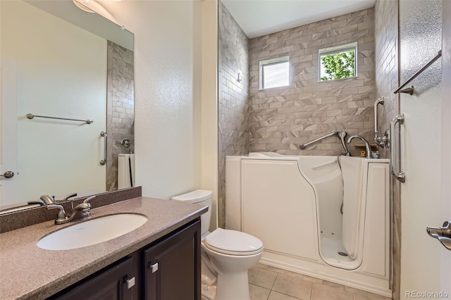 5495 Espana Ct, Denver, CO 80249 - bathroom featuring tile patterned floors, a bathtub, and vanity