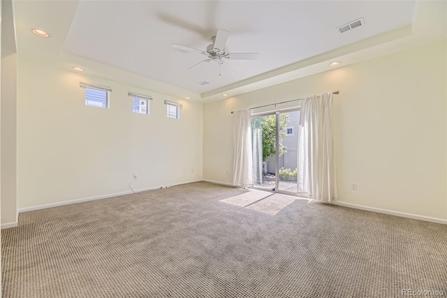 5495 Espana Ct, Denver, CO 80249 - spare room with a raised ceiling, carpet flooring, ceiling fan, and recessed lighting