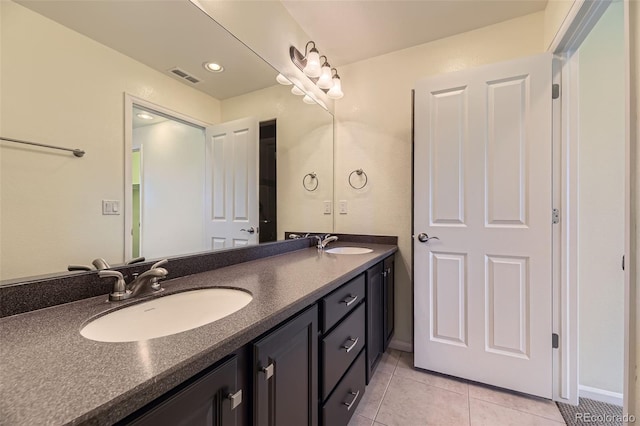 5495 Espana Ct, Denver, CO 80249 - full bath featuring double vanity and tile patterned flooring