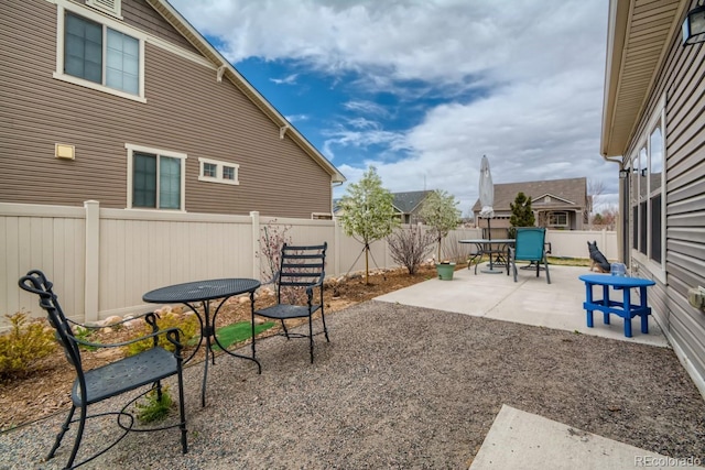 5495 Espana Ct, Denver, CO 80249 - fenced backyard with a patio and outdoor dining area