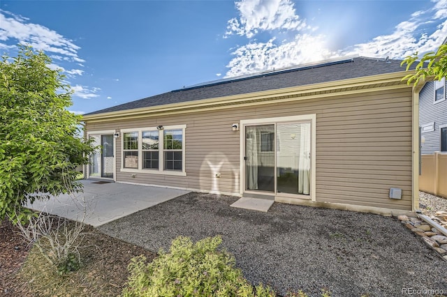 5495 Espana Ct, Denver, CO 80249 - back of property featuring a patio area