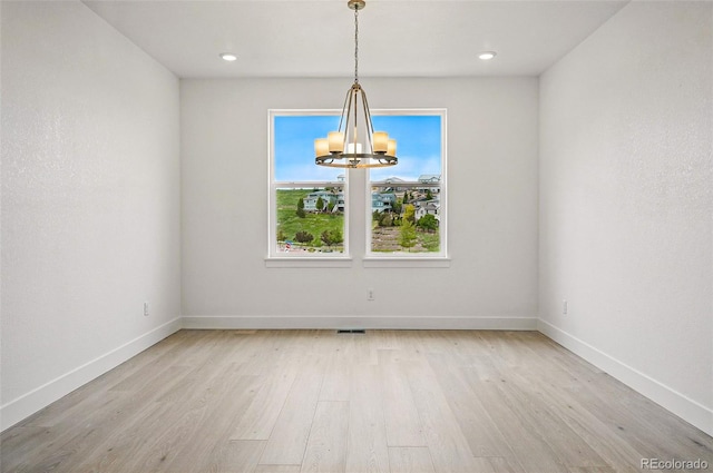 9382 Quaker St, Arvada, CO 80007 - unfurnished dining area featuring a chandelier, light wood-style flooring, baseboards, and recessed lighting