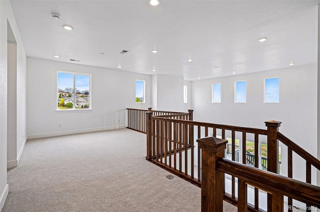 9382 Quaker St, Arvada, CO 80007 - hall featuring an upstairs landing, carpet, recessed lighting, healthy amount of natural light, and baseboards