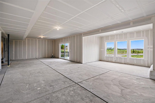 9382 Quaker St, Arvada, CO 80007 - empty room with healthy amount of natural light and concrete floors