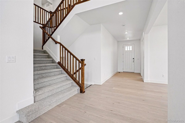 9382 Quaker St, Arvada, CO 80007 - entryway featuring light wood-type flooring, baseboards, stairway, and recessed lighting