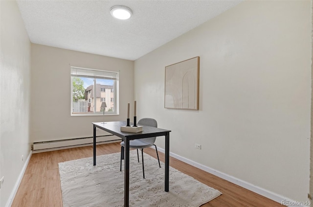 9650 Huron St Unit 12, Thornton, CO 80260 - office space with baseboard heating, wood finished floors, baseboards, and a textured ceiling