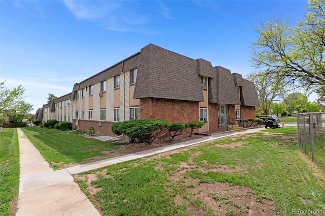 9650 Huron St Unit 12, Thornton, CO 80260 - view of building exterior featuring fence