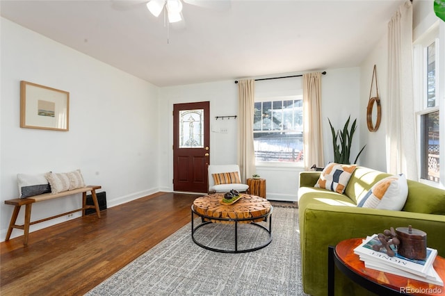 living room with dark hardwood / wood-style floors and ceiling fan