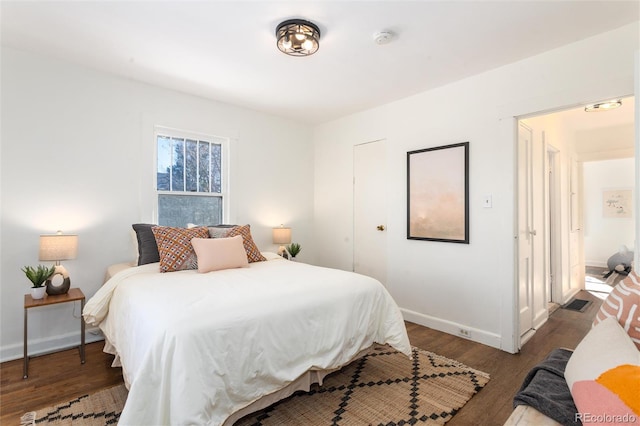 bedroom featuring dark hardwood / wood-style floors