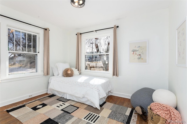 bedroom with hardwood / wood-style flooring