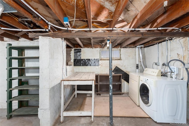 basement with washer and clothes dryer