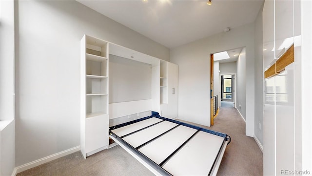 unfurnished bedroom with light colored carpet