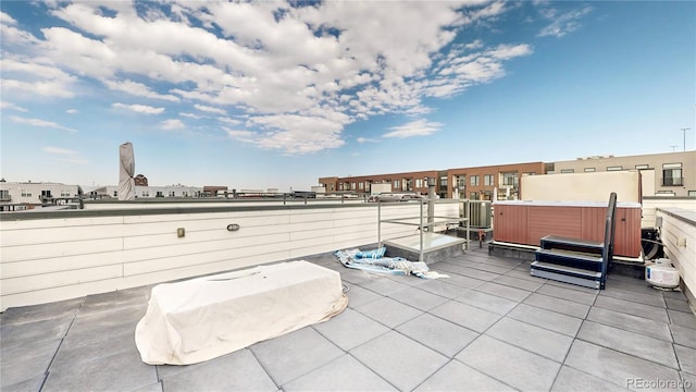 view of patio / terrace with a hot tub