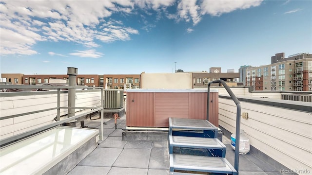 view of patio with a jacuzzi and central AC unit