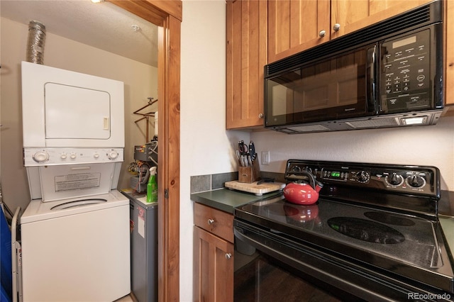 washroom with stacked washer / dryer