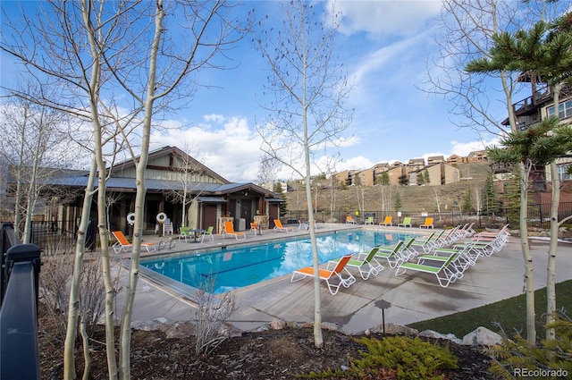 view of swimming pool with a patio