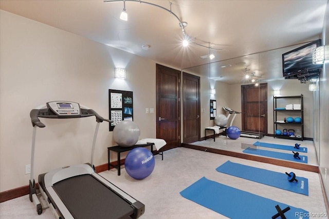 workout room with light colored carpet