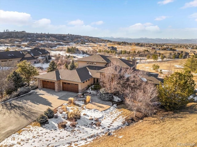 birds eye view of property featuring a mountain view