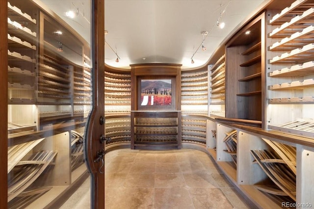 10370 Grande Vista Ct, Lone Tree, CO 80124 - wine room featuring track lighting and tile patterned flooring