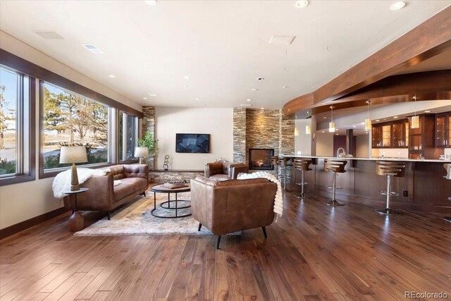 10370 Grande Vista Ct, Lone Tree, CO 80124 - living room featuring dark wood-style floors, a fireplace, recessed lighting, and baseboards