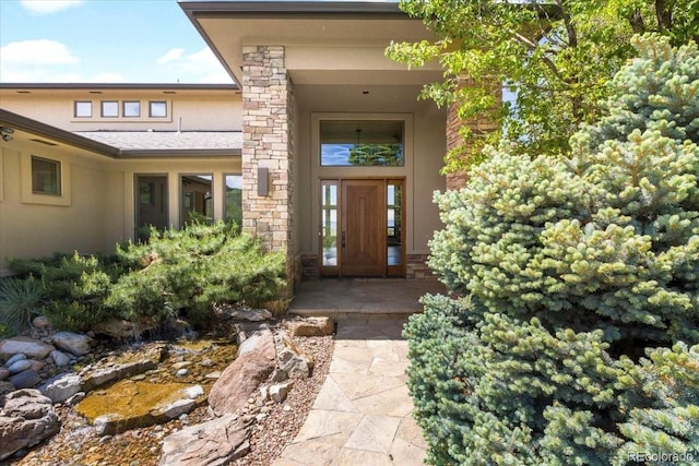 10370 Grande Vista Ct, Lone Tree, CO 80124 - view of exterior entry with stucco siding and stone siding